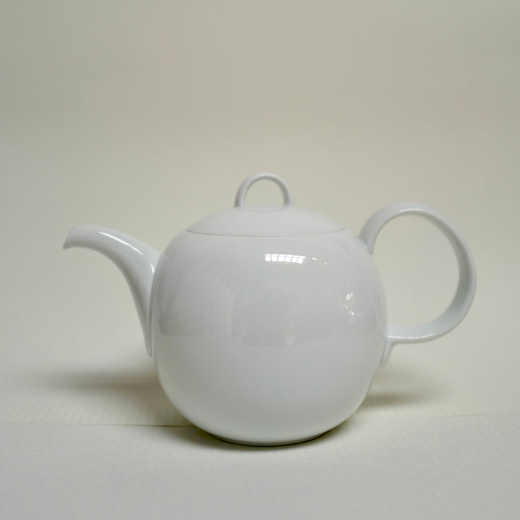 A glossy Hakusan Porcelain Hakuji Mayu porcelain Tea Pot in plain background. 