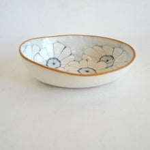 Ceramic bowl with floral patterns on a white background