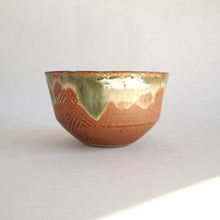 Ceramic bowl with a textured surface on a white background