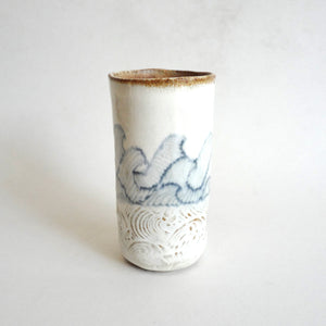 Spako Clay tumbler blue line drawing of waves and emboss pattern, white glaze