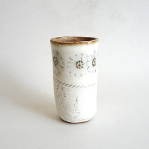 Spako Clay tumbler black line drawing of flowers and emboss pattern, white glaze