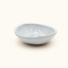 Light blue ceramic dish on a white background