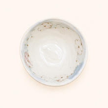 Ceramic bowl with floral design on a white background