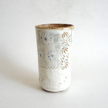 Spako Clay tumbler blue line drawing of flowers and emboss pattern, white glaze