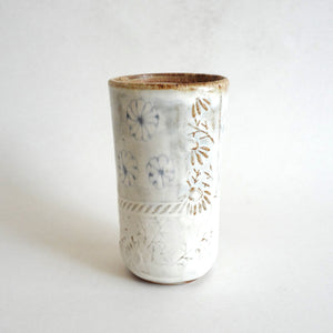 Spako Clay tumbler blue line drawing of flowers and emboss pattern, white glaze