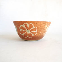 Ceramic bowl with floral design on a white background