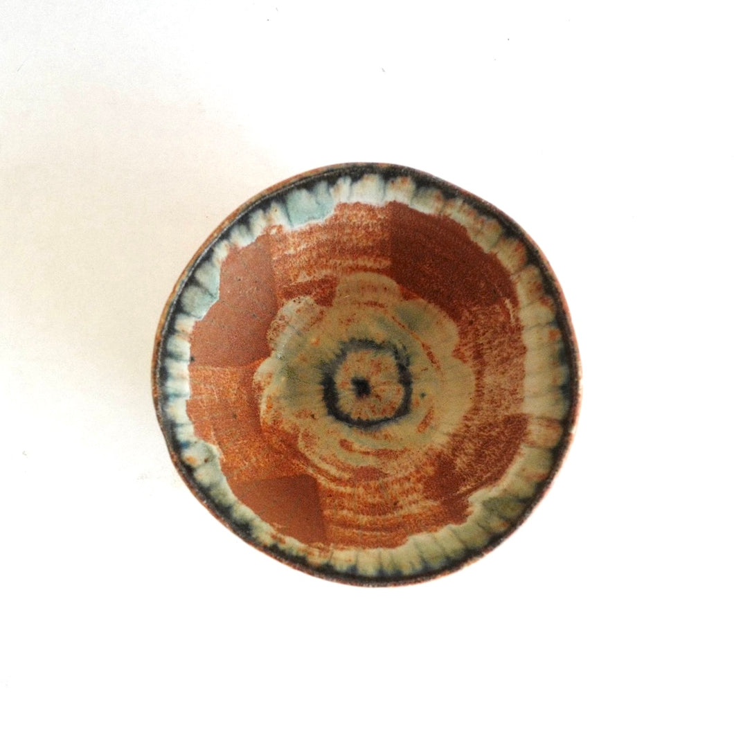 Ceramic bowl with a unique design on a white background