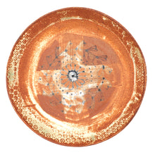 Ceramic plate with decorative patterns on a white background