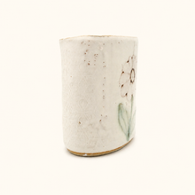 Spako Clay White ceramic vase with speckled texture and floral design on a white background
