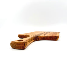 Wooden cutting board with a handle on a white background