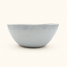 Light ceramic bowl on a white background