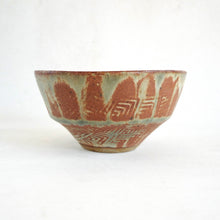 Ceramic bowl with geometric pattern on a white background
