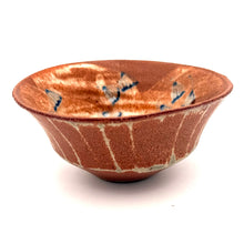 Ceramic bowl with a unique pattern on a white background