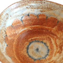 Close-up of a ceramic bowl with concentric circular patterns
