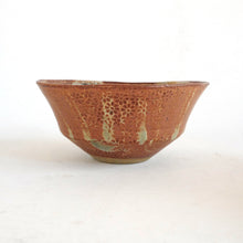 Ceramic bowl with textured surface on a white background