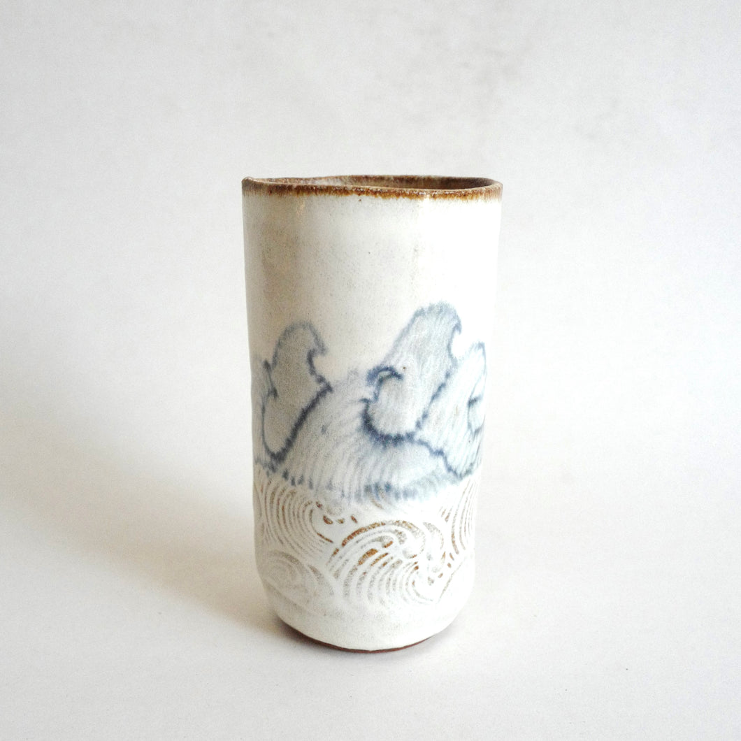 Spako Clay tumbler blue line drawing of waves and emboss pattern, white glaze