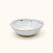 Spako Clay ceramic dish with floral pattern on a white background