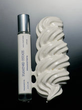 Roll-on bottle and dessert cream on a gray background