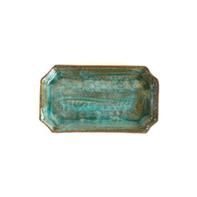 Rectangular ceramic tray with textured surface on a white background