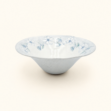 Ceramic bowl with floral pattern on a white background