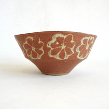 Ceramic bowl with floral patterns on a white background