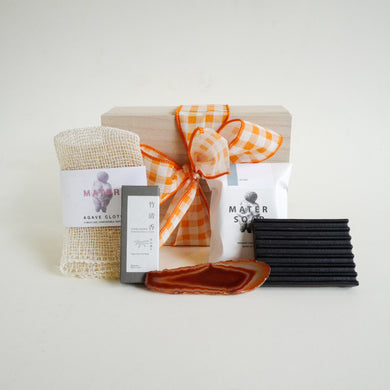 Collection of items in gift box with ribbon 