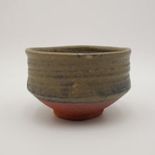 A handmade ceramic tea bowl with a textured, ribbed upper half in a dark olive-green glaze and a contrasting reddish-brown unglazed base, shown on a neutral light gray background.