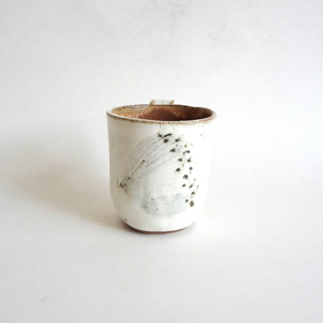 Spako Clay mug. Black line wildflower drawing, white glaze