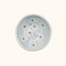 Spako Clay ceramic dish with floral pattern on a white background
