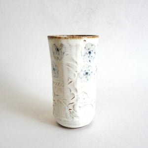 Spako Clay tumbler blue line drawing of flowers and emboss pattern, white glaze