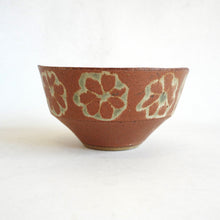 Ceramic bowl with floral patterns on a white background