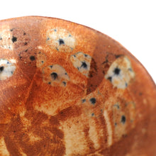 Ceramic bowl with floral design on a white background