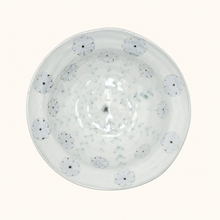 Ceramic bowl with floral pattern on a white background