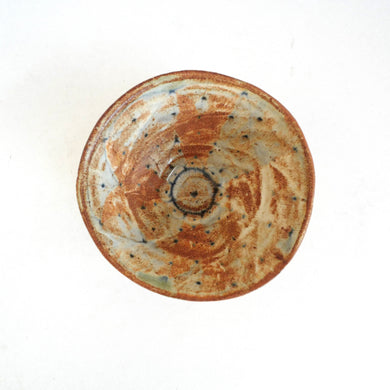 Ceramic bowl with a unique pattern on a white background