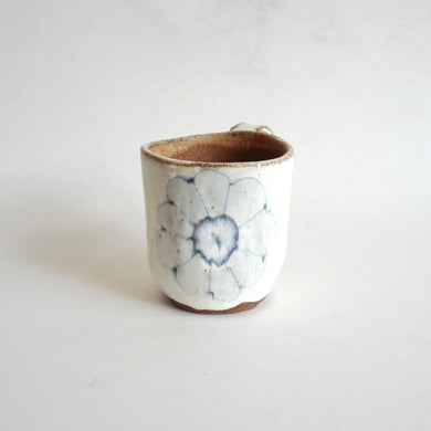 Spako Clay mug. Blue line flower drawing, white glaze