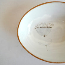 Ceramic bowl with a floral design on a plain background