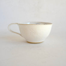 Cappuccino mug on beige background
