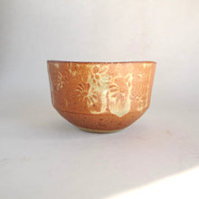 Ceramic bowl with floral patterns on a white background