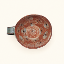 Spako Clay cappuccino mug with a floral design on a white background