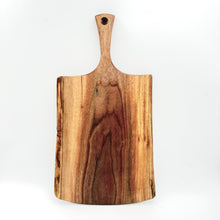 Wooden cutting board with a handle on a white background