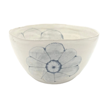 Ceramic bowl with blue floral design on a white background