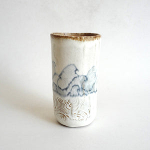 Spako Clay tumbler blue line drawing of waves and emboss pattern, white glaze