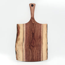 Wooden cutting board with a handle on a white background