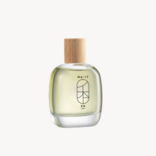 Clear glass bottle with wooden cap on a white background
