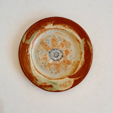 Ceramic plate with decorative design on a white background