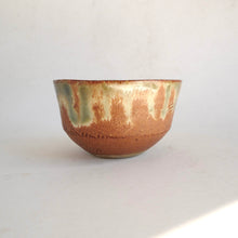 Ceramic bowl with a textured surface on a white background