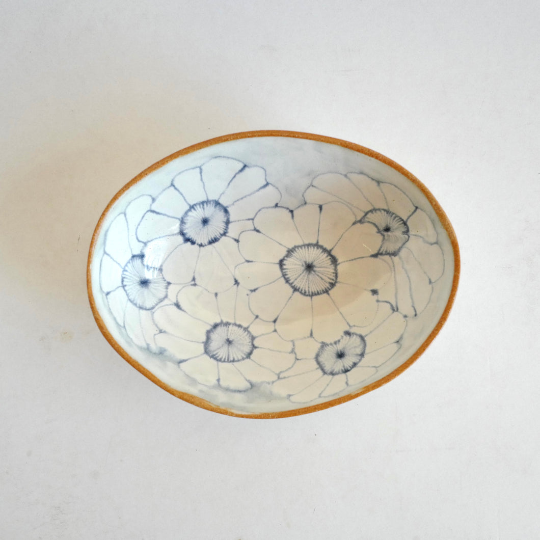 Ceramic bowl with floral design on a white background