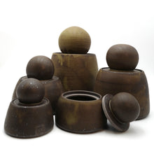 A group of MH Studio stash jar with lids on white background 
