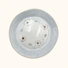 Ceramic plate with floral patterns on a white background