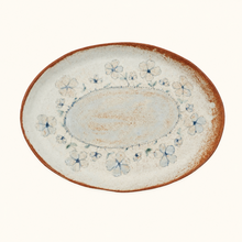 Ceramic plate with floral patterns on a white background